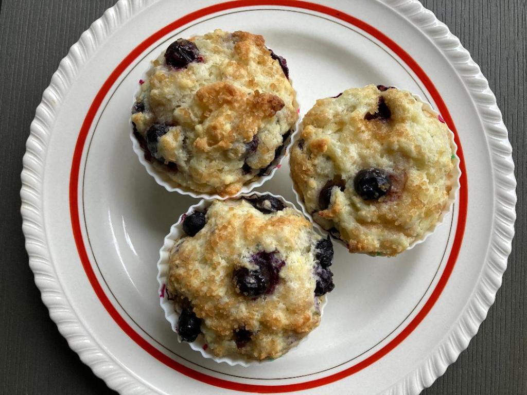 Plate with three blueberry muffins
