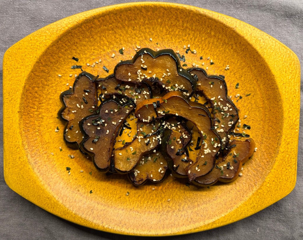 photo of a plate of roasted squash with furikake sprinkled on top